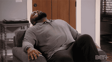 GIF of Ms. Pat&#x27;s husband sitting in a chair looking frustrated