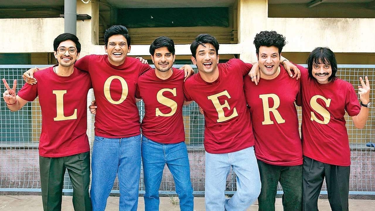 The cast of chhichhore smiles and poses for a picture, wearing t-shirts that collectively spell &quot;losers&quot;
