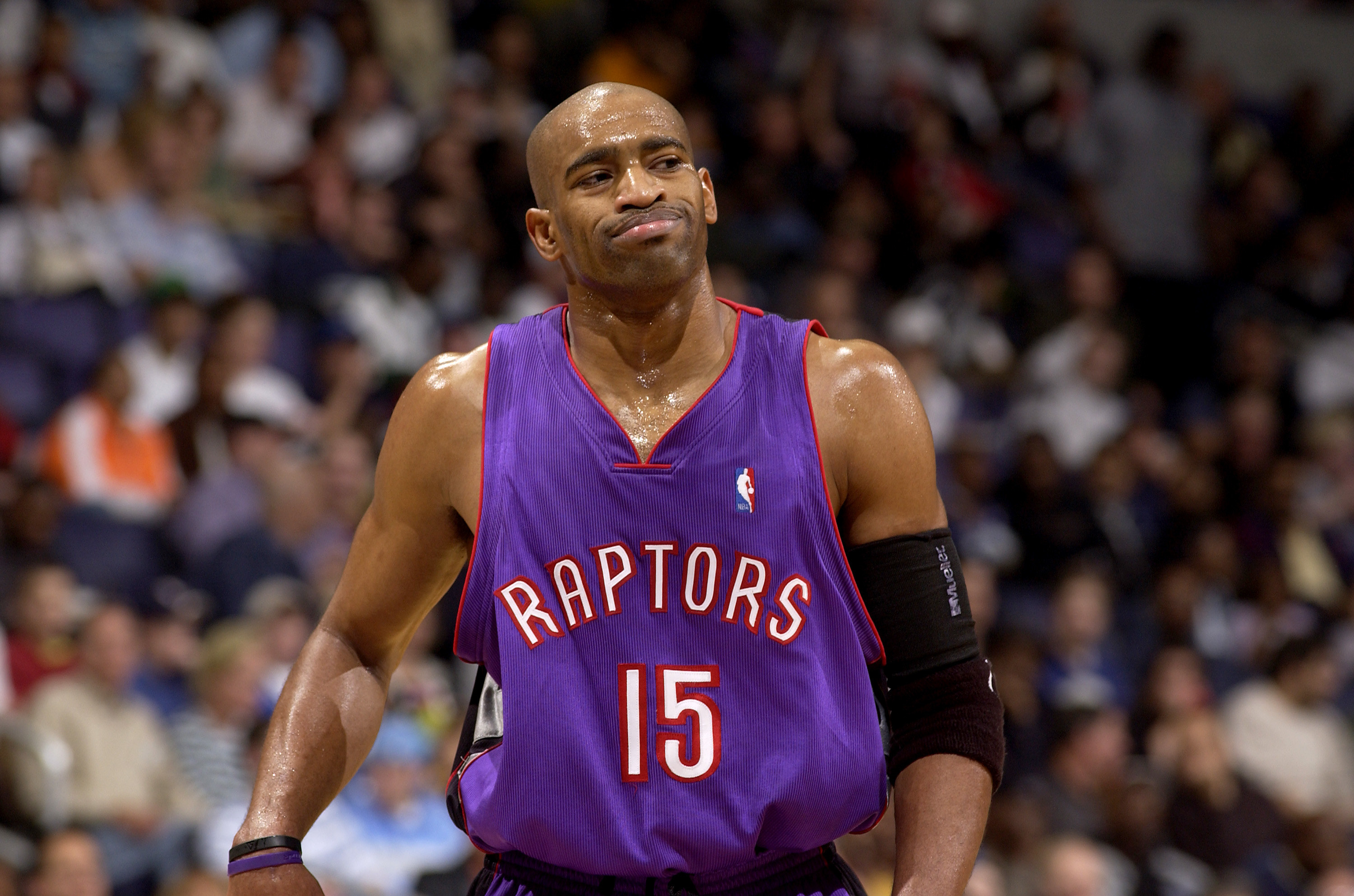 Purple Raptors jersey with red outlining and white lettering