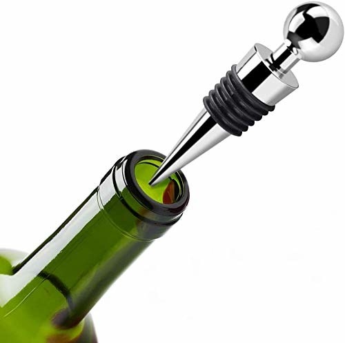 Green wine bottle tip with wine stopper