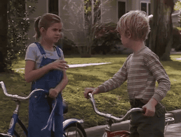 Anna Chlumsky and Macaulay Culkin spit into their palms and shake hands in My Girl