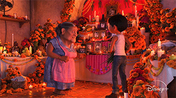 Coco shows Miguel a picture of her and her mother