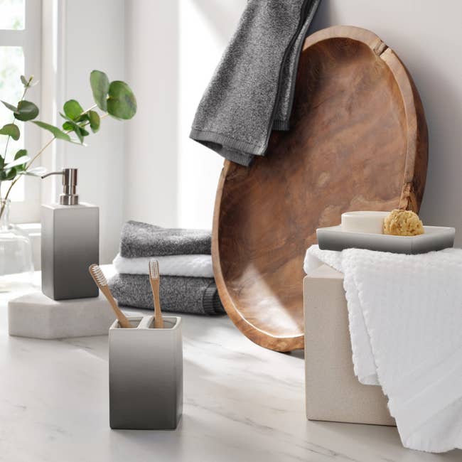 The gray ombre accessories set in a bathroom