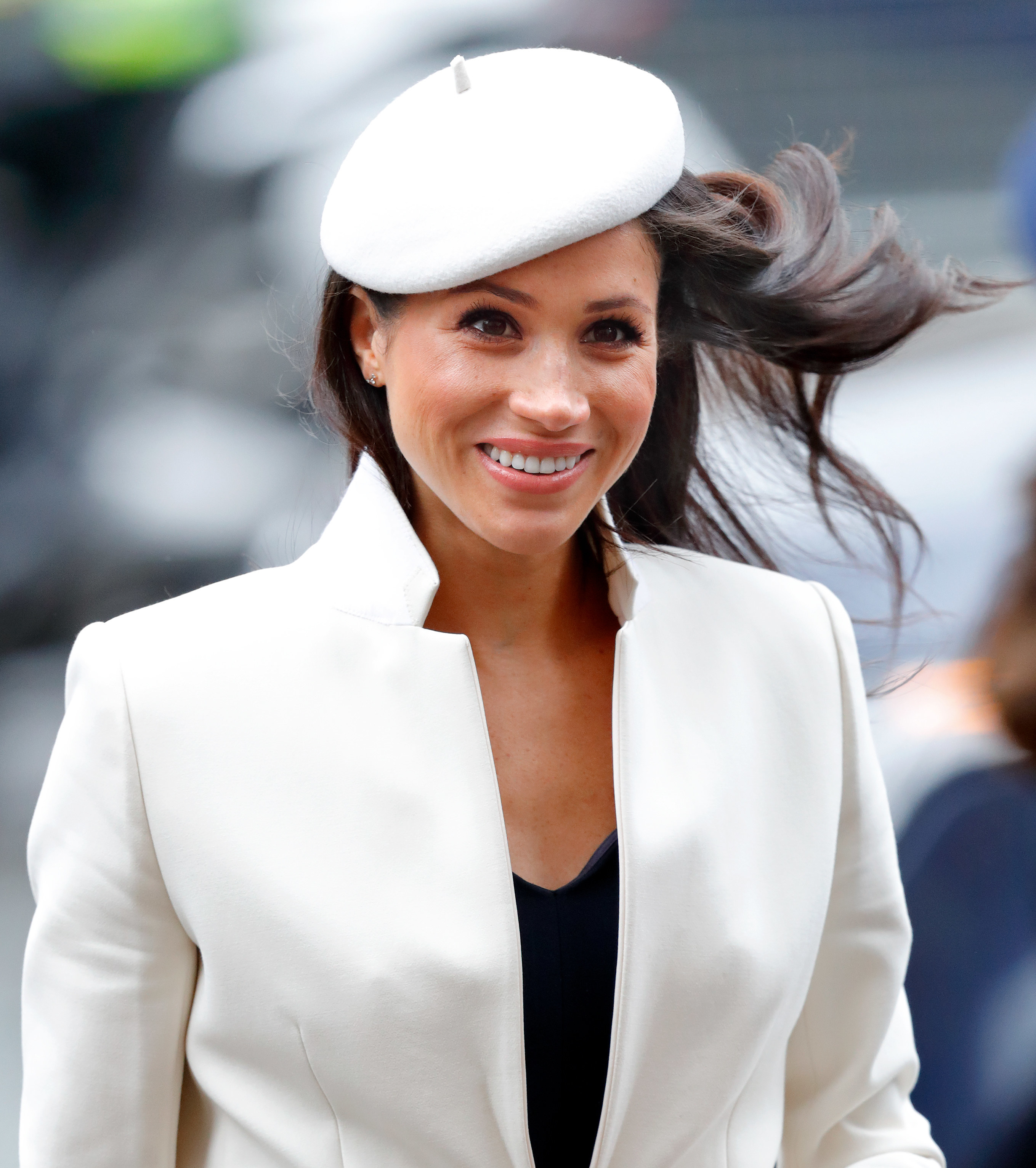 Meghan Markle in a white suit.