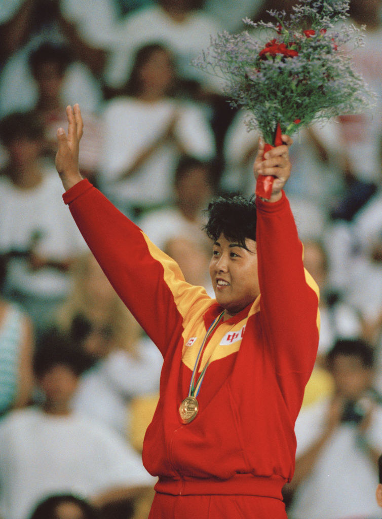Zhuang Xiaoyan of China celebrates winning the gold medal in the Women&#x27;s +72 kg Judo competition