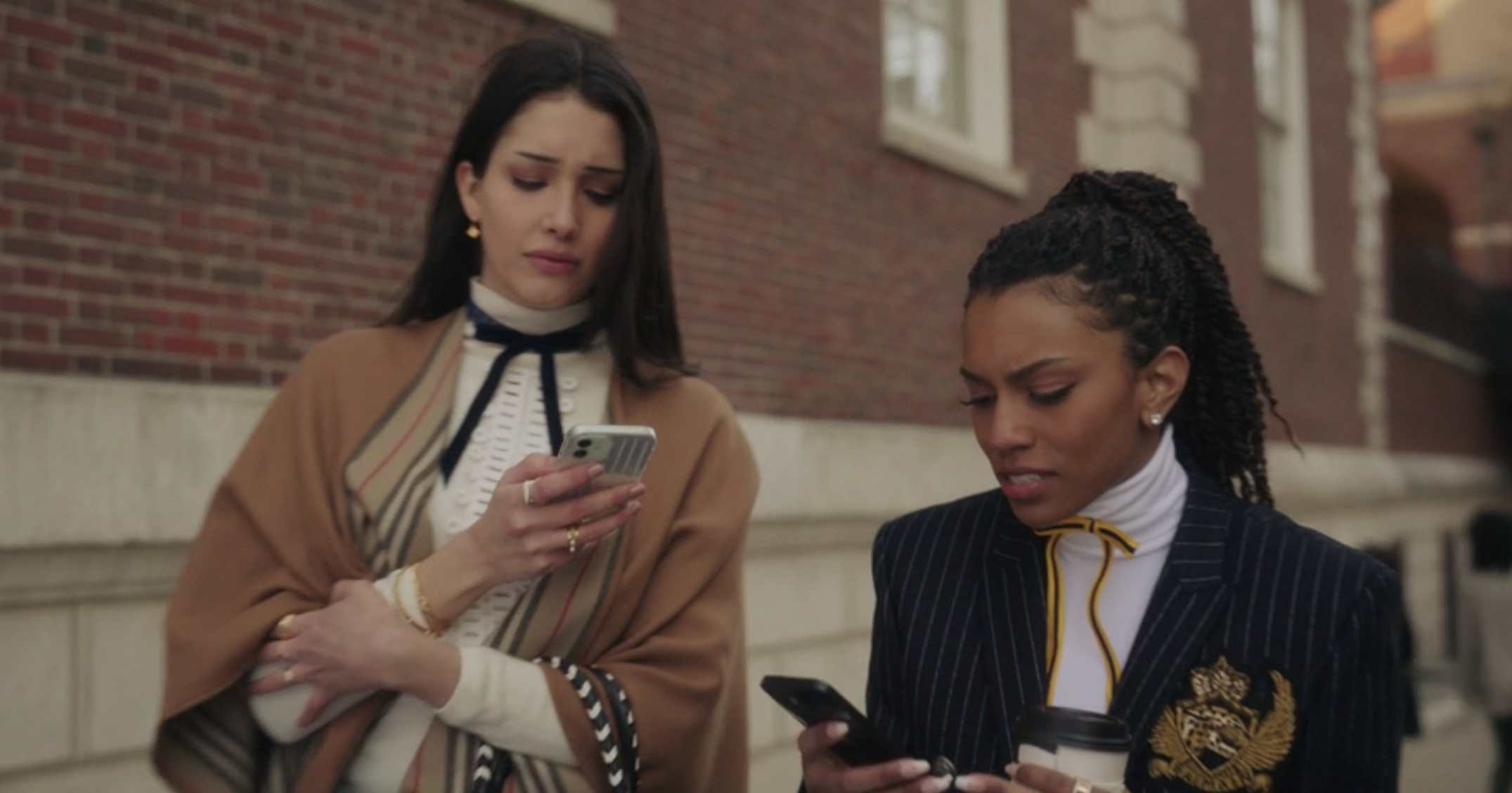 Luna wears a striped poncho over a ruffled shirt with a skinny bow tie, and Monet wears a pin-striped blazer over a turtleneck and a bright skinny bow tie