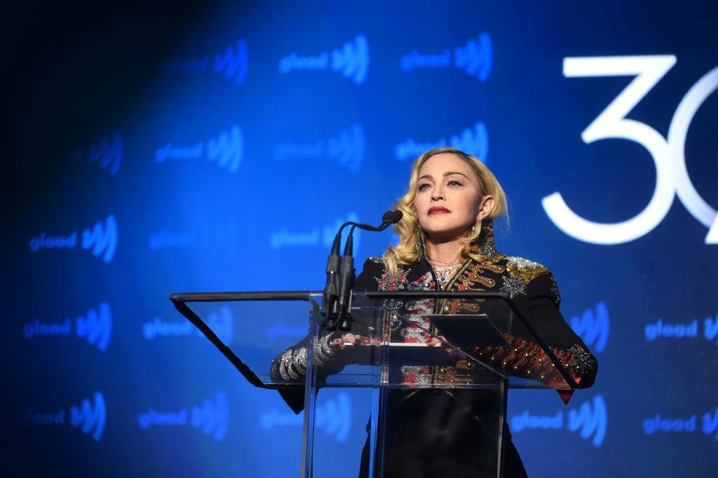 Madonna standing at the podium at a GLAAD event