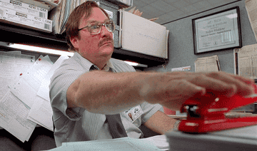 Milton Waddams from Office Space grabbing his red stapler
