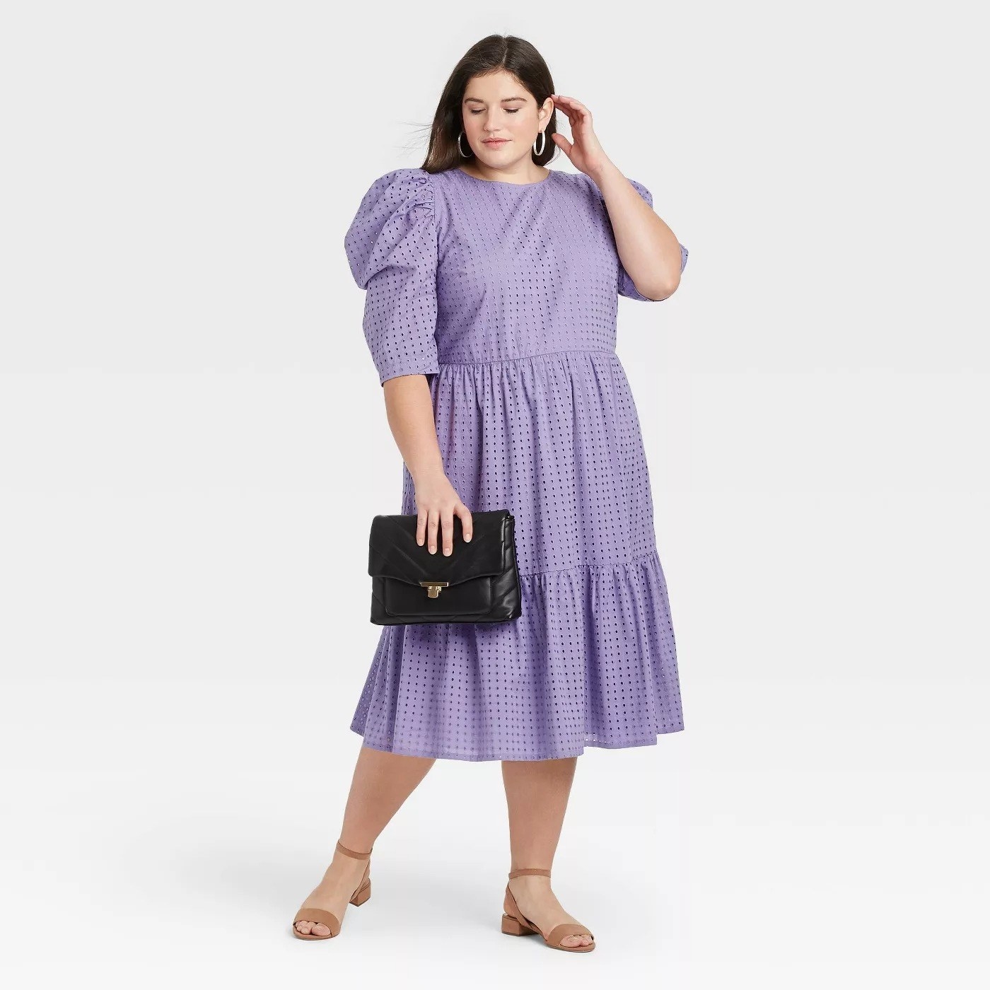 Model wearing lilac midi dress with 3/4 sleeves