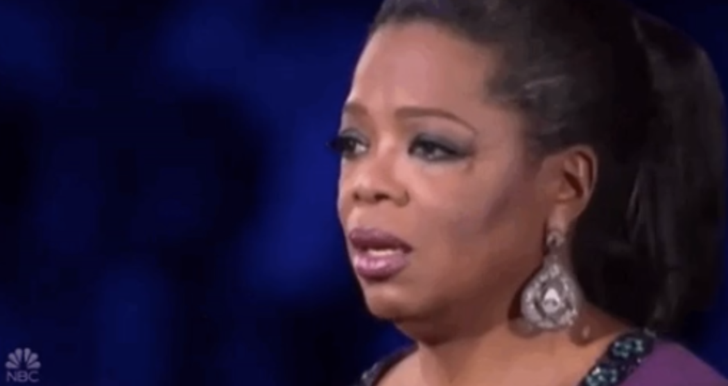 Oprah looking stunned and saddened