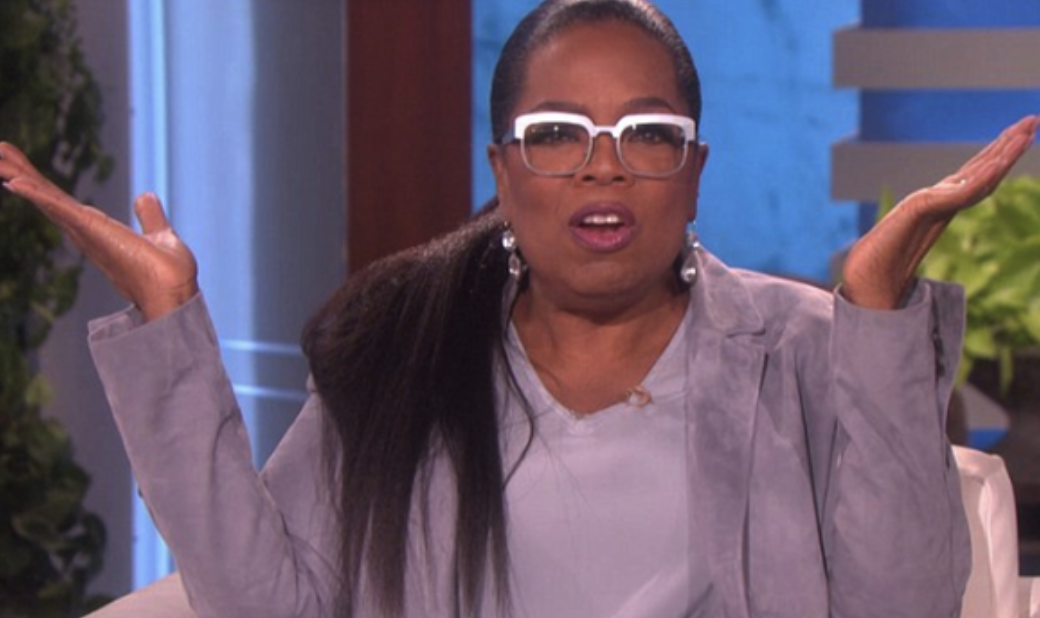 Oprah wearing glasses and looking mildly surprised