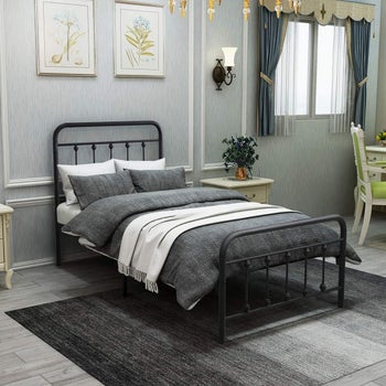 lifestyle image of the bed in black in a bedroom with gray walls
