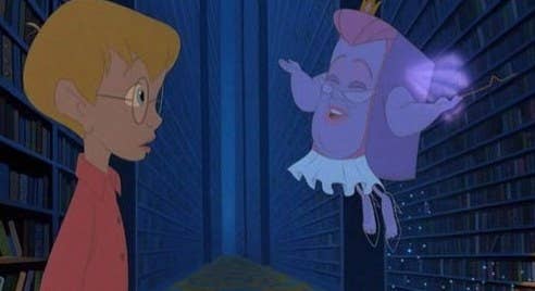 An animated Richard looks at Fantasy, the talking book, in The Pagemaster