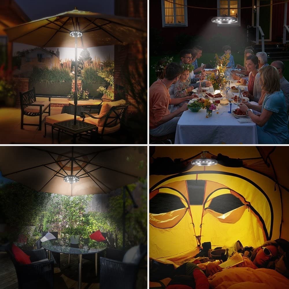 the umbrella light lighting up a patio tables and a tent