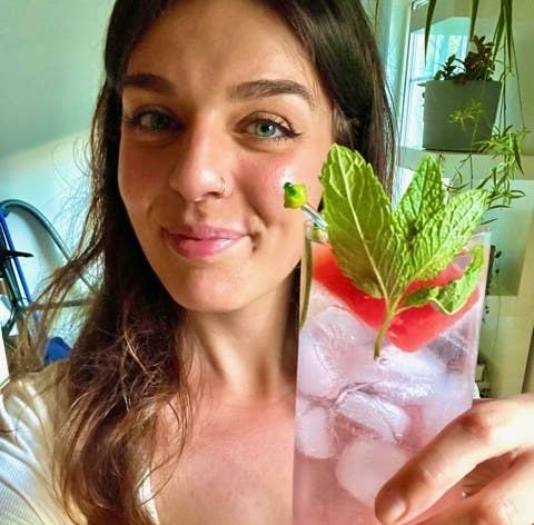 brittany holding a watermelon spritz cocktail