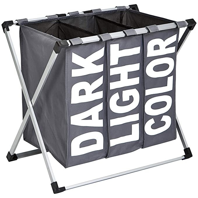 The laundry hamper has slots for dark, light, and coloured clothes