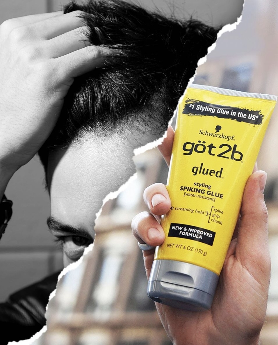 A tube of styling glue with a man holding his hair