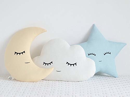 Moon, sun and star pillows with faces on them