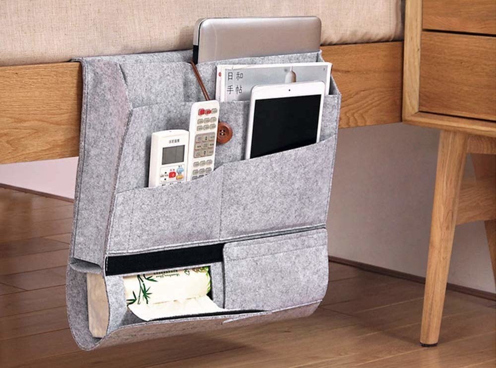 A bedside caddy with items in it