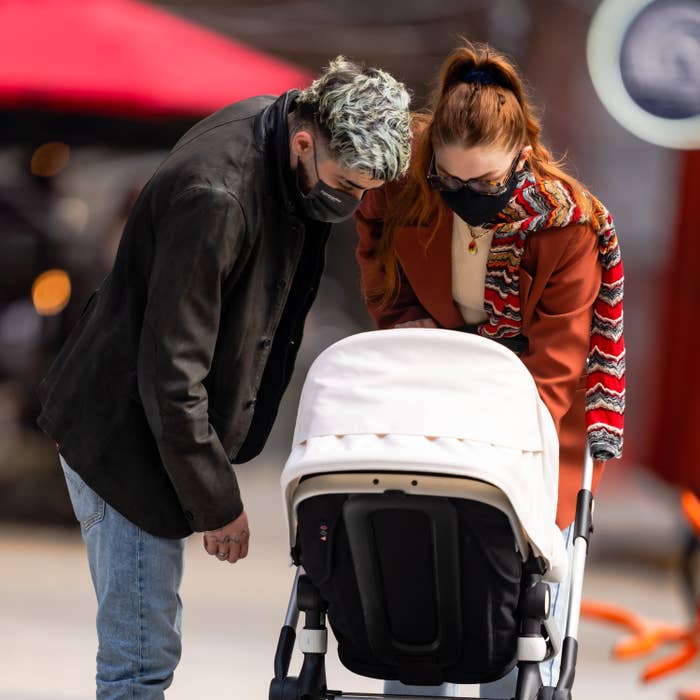 Zayn Malik and Gigi Hadid are seen walking daughter Khai in her stroller in NoHo on March 25, 2021, in New York City