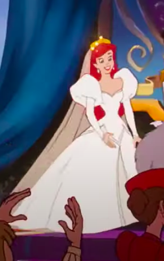 Ariel wearing a dress with big shoulders and then tight sleeves