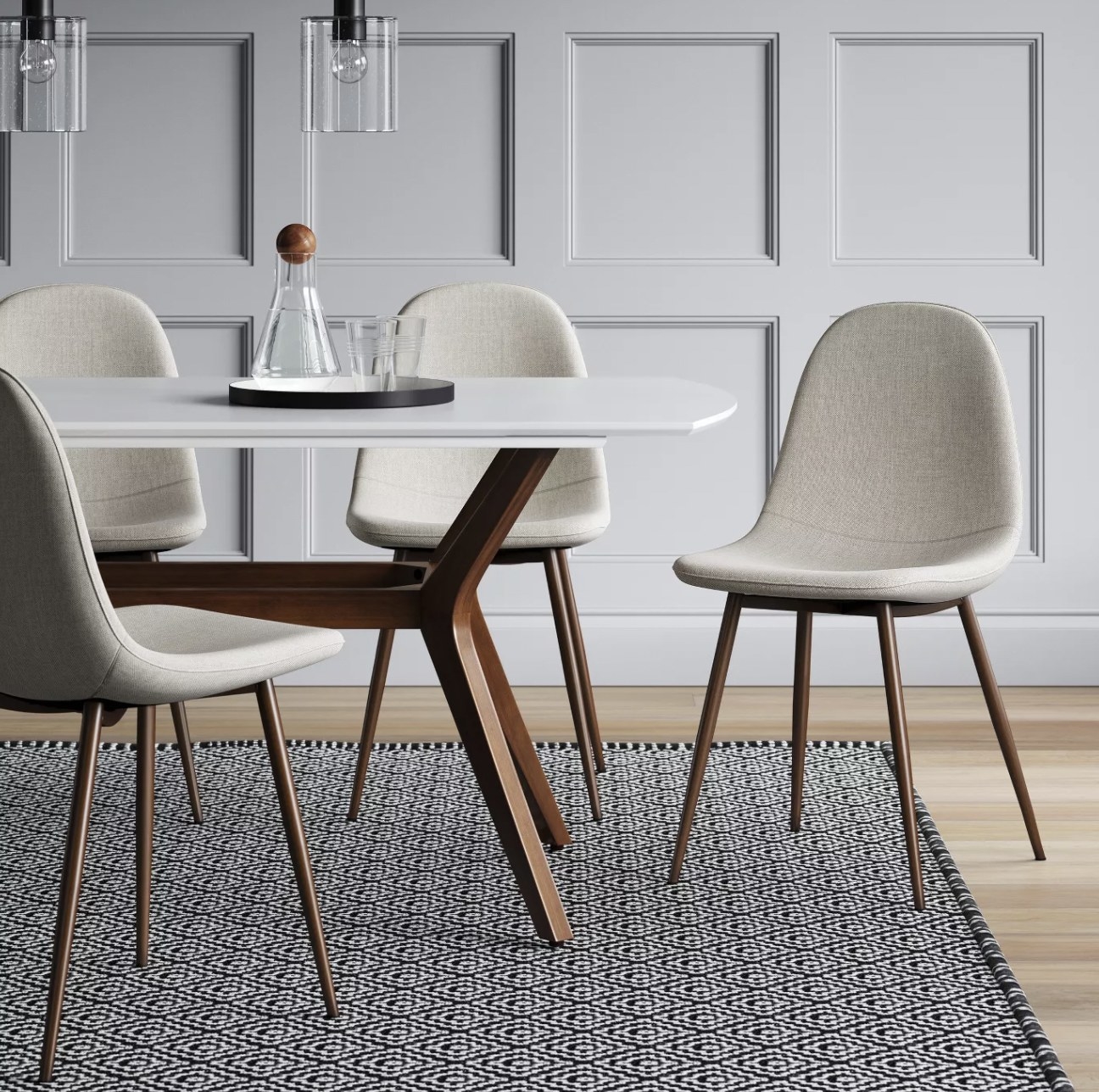 a beige upholstered dining chair with wooden legs