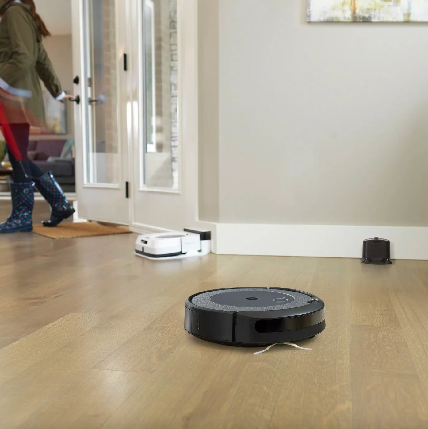 the iRobot vacuum at work on a hardwood floor