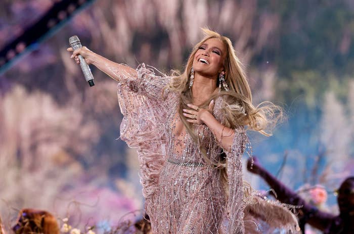 Jennifer Lopez looks elated on stage.