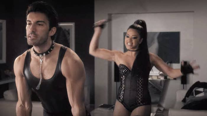 Jane from "Jane the Virgin" wearing lingerie while spanking Rafael, whose wearing a leather tank top and spiked dog collar