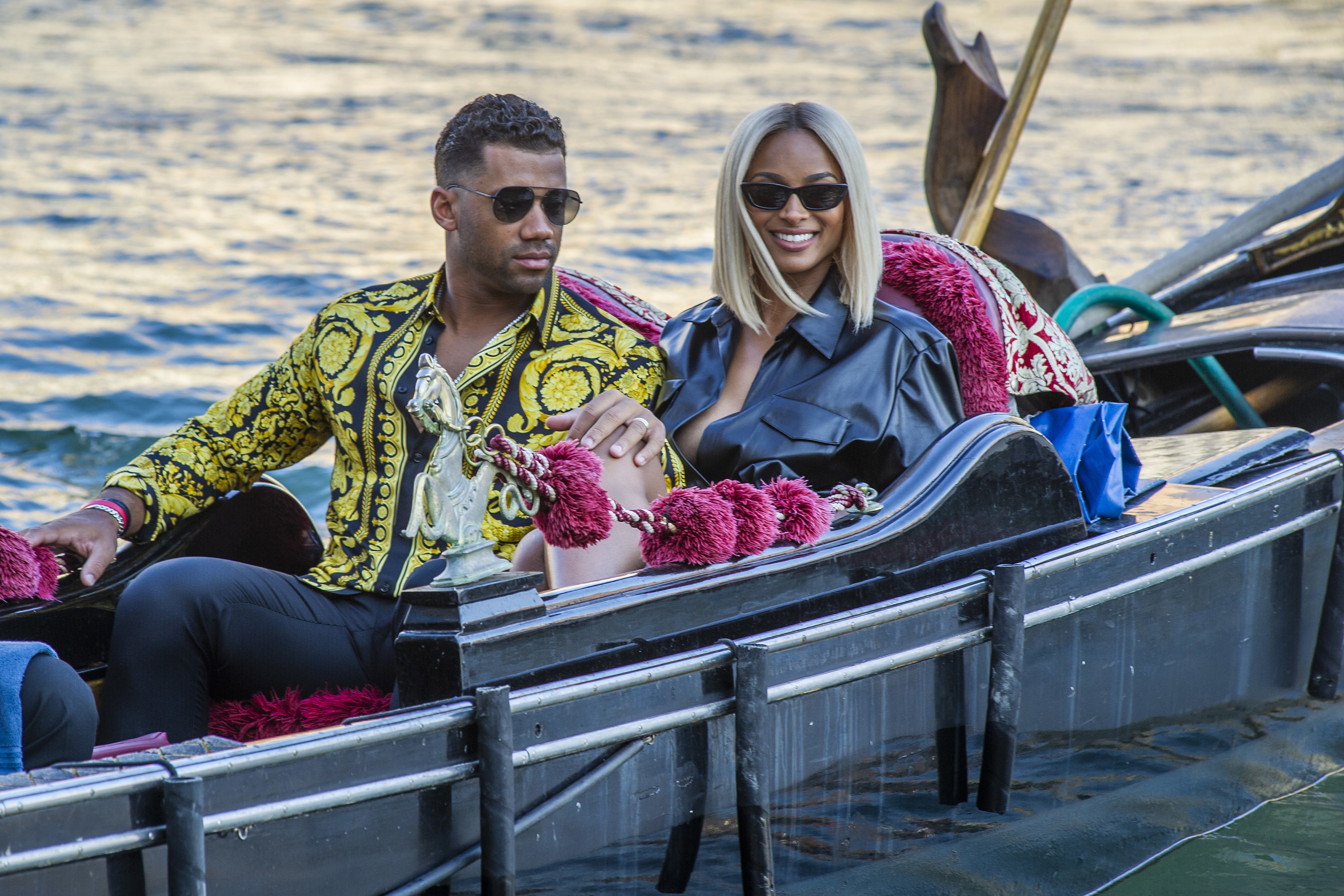 Russell Wilson and Ciara are seen during a gondola tour on the Grand Canal on July 01, 2021, in Venice, Italy