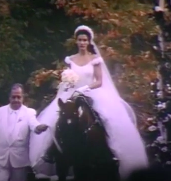 Maggie wearing an off-the-shoulder ballgown