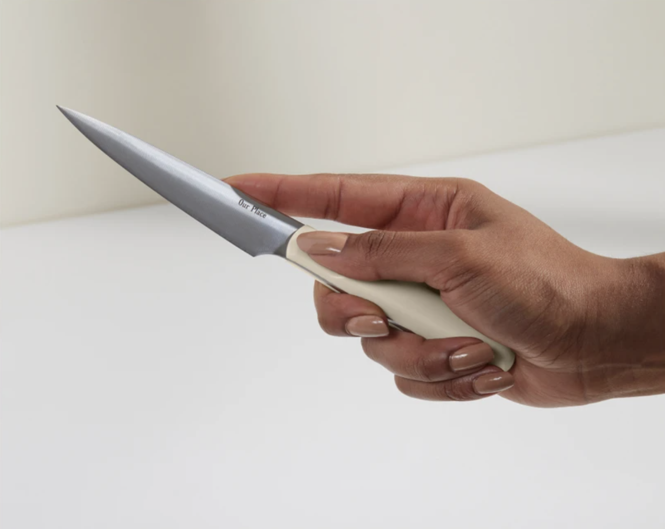 A person holds the knife up close