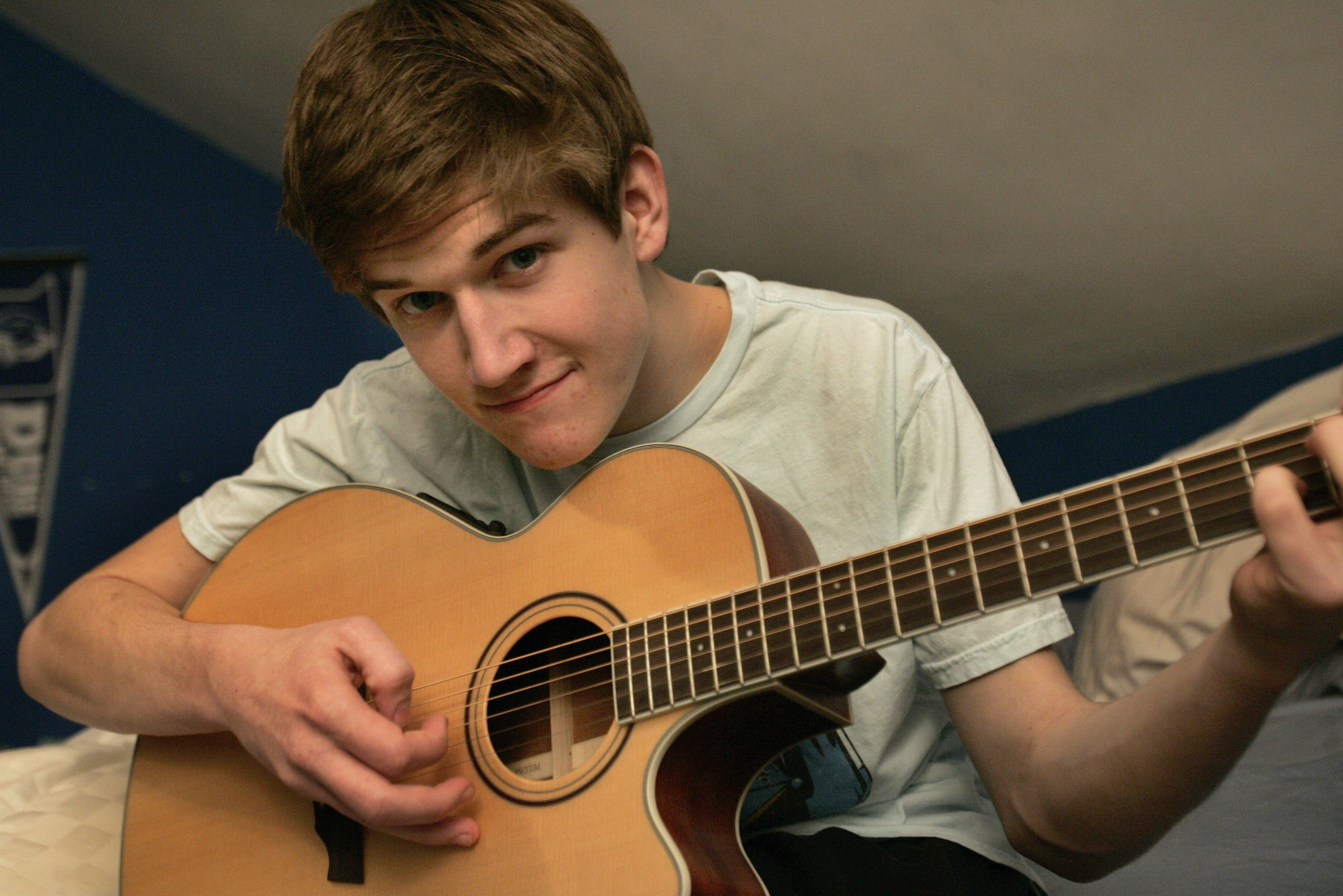 Bo playing acoustic guitar