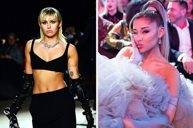 Miley Cyrus is on the left walking on a runway with Ariana Grande on the right