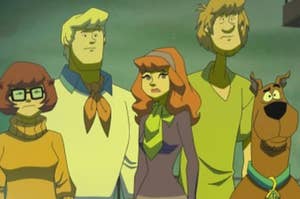 Velma, Fred, Daphne, Shaggy, and Scooby stare worriedly out into the distance.