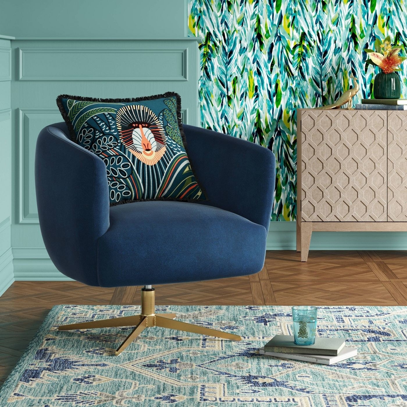 a blue velvet armchair that swivels, with brass legs