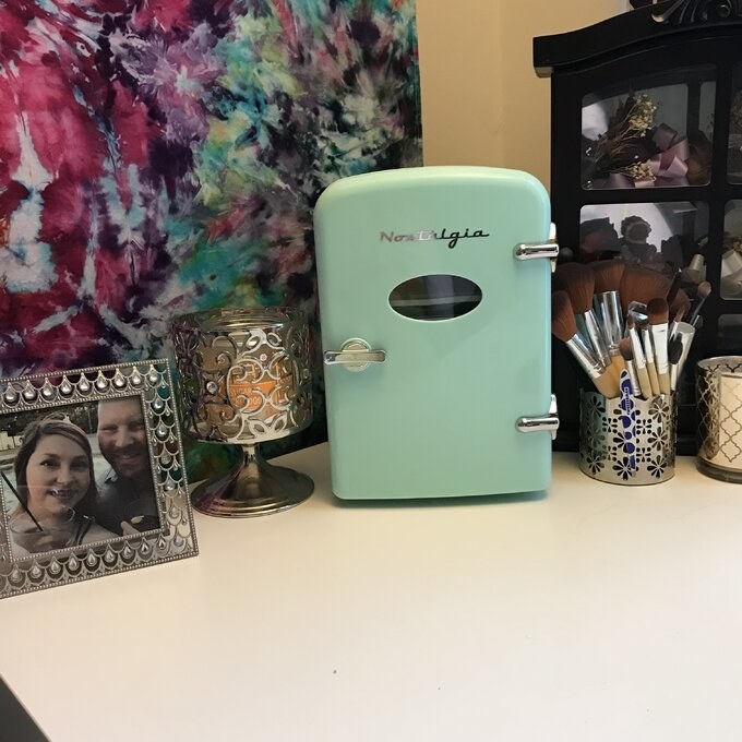 the blue mini fridge on a counter