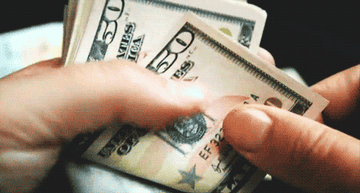 A hand counting money