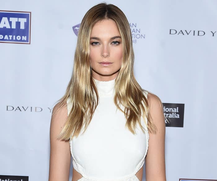 Bridget looks serious in a white dress while attending an event