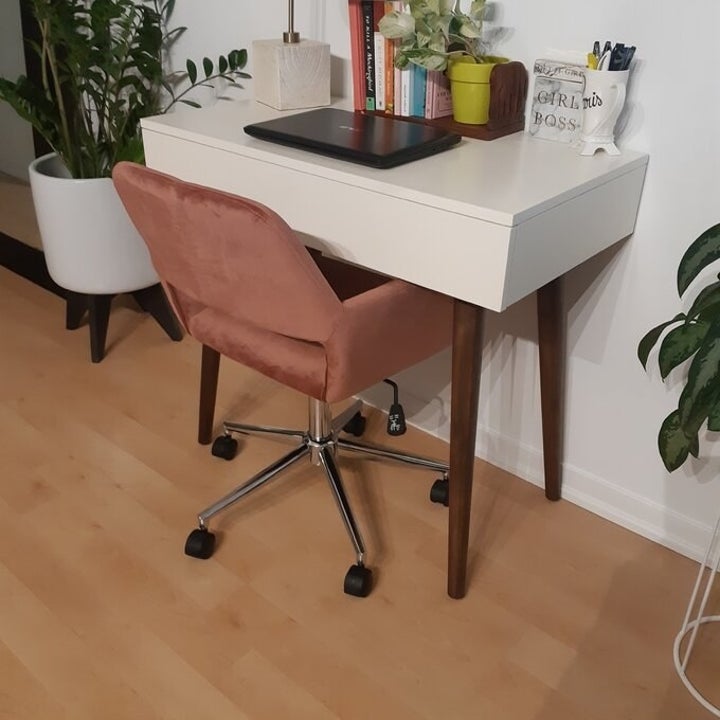 the pink task chair with a white desk