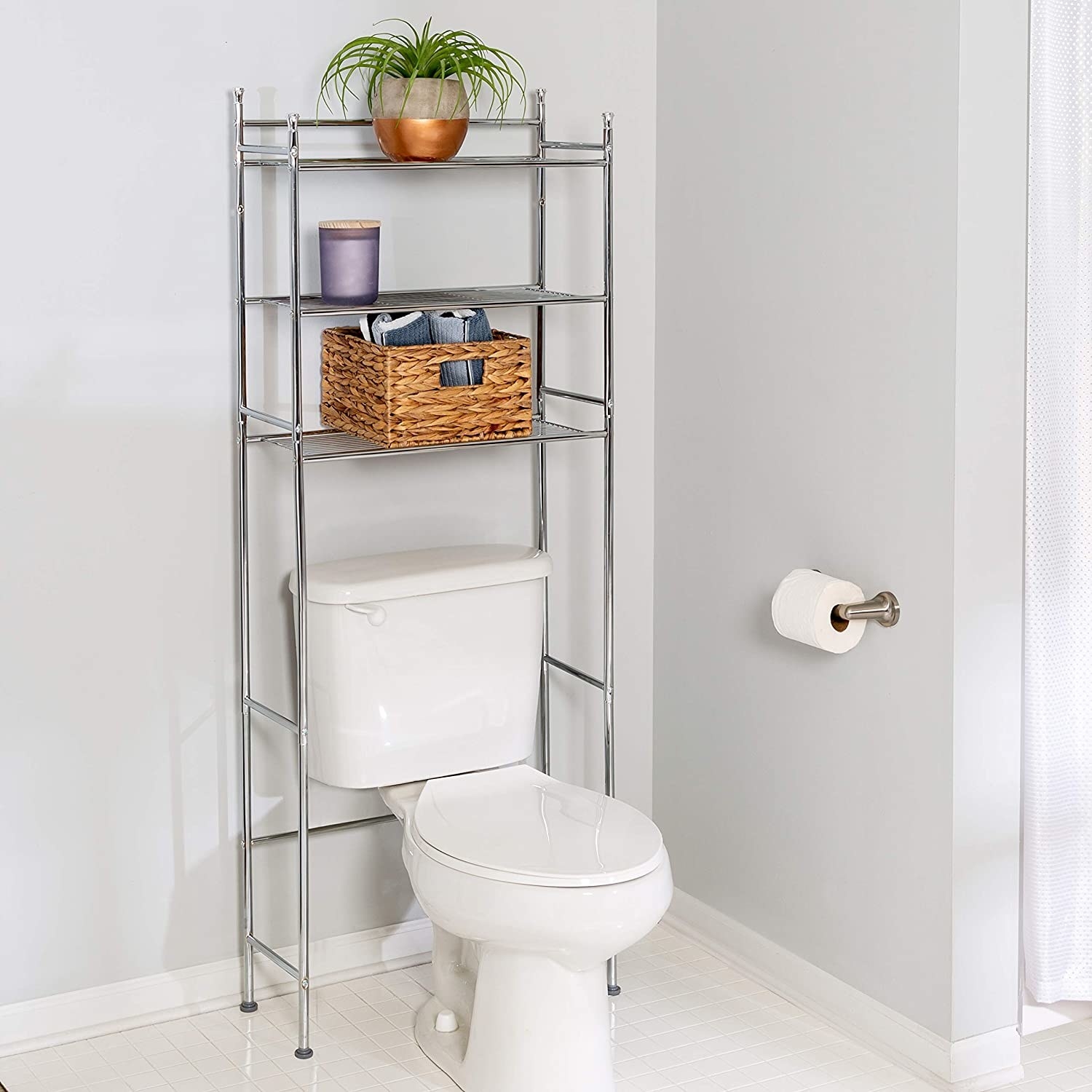 A multi-tiered shelf placed over a toilet The shelves are filled with beauty products aand toilet paper