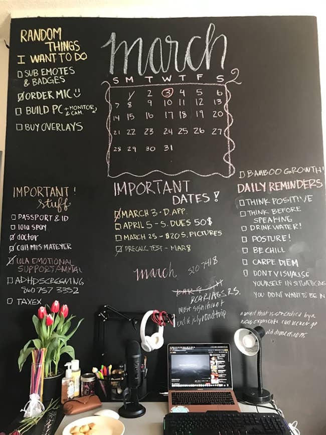 reviewer image of an office wall painted with black chalkboard paint, important dates and memos written in chalk