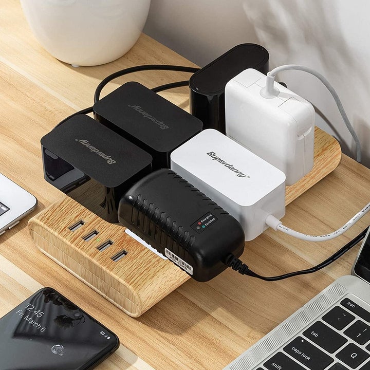 The power bar with several devices plugged in simultaneously