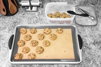 A customer review photo of a cookie sheet with the mats and fresh based cookies