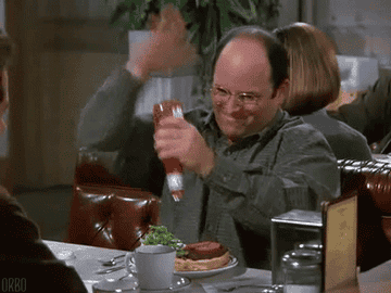 George from &quot;Seinfeld&quot; putting ketchup on a burger.