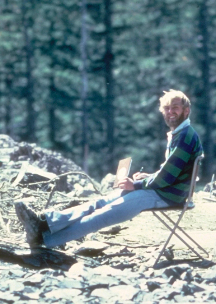 American volcanologist, David A. Johnston sitting at the Mount St. Helens eruption site in 1980