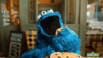 Cookie Monster eating cookies.