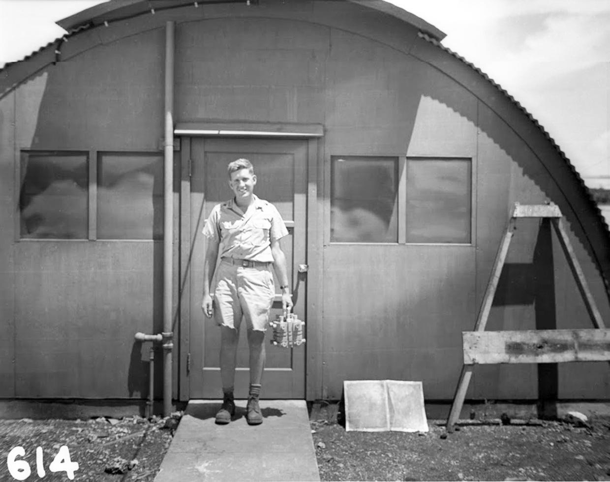 Harold Agnew holding the nuclear core of the Fat Man atomic bomb