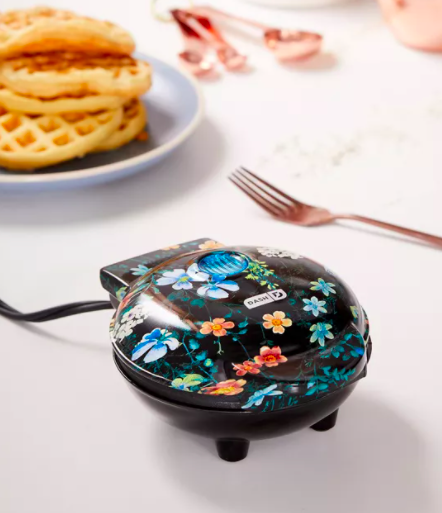 A close up of the mini waffle maker; it has a floral pattern