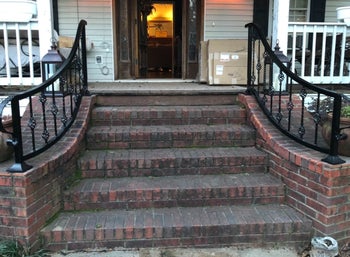 a reviewer photo of dirty brick steps 